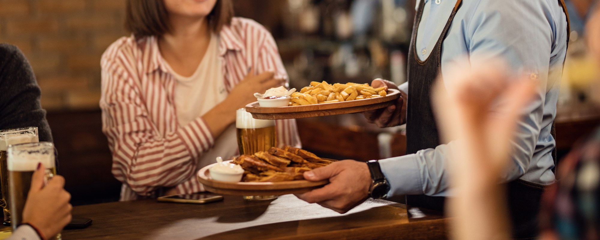Food being served to table in gastro pub